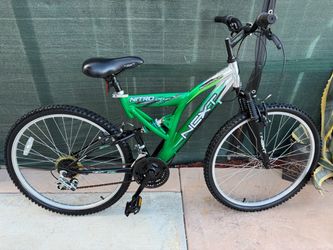 Green  Next Shocker dual-suspension mountain bike with a 26-inch frame.