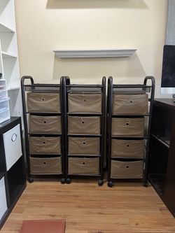 3 Rolling Metal Shelves with Fabric Bins. Metal shelves are in excellent condition, bins are in lightly used condition.