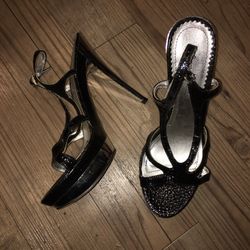 Black platform shoes with silver heel, women's size 8