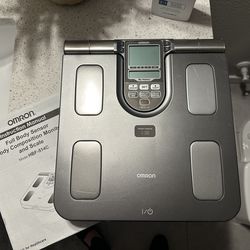 Weight scale with body composition reader