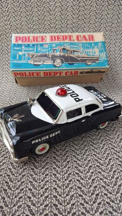 Vintage friction Police Department car