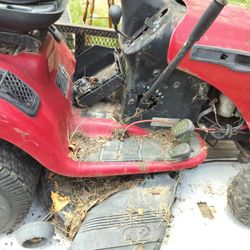 A Red Craftsman Lawn Mower It's Got A 42 Inch Deck It's Not Locked Up It Just Needs A Carburetor I Have The Old One So You Know What To Get