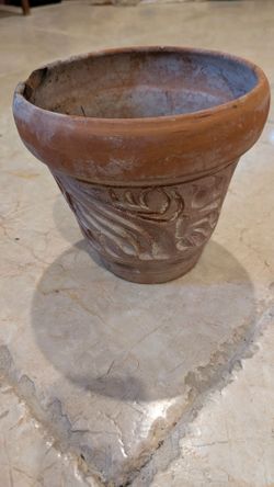 Decorative clay 8' pot slight damage on edge