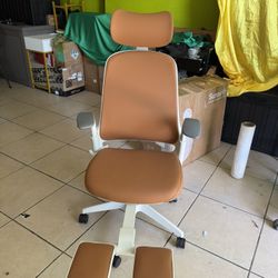 Sunaofe Boss Pro Ergonomic Chair featuring a white frame and brown leather upholstery.