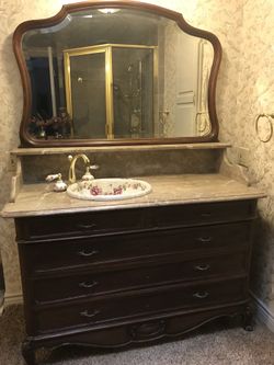 Antique sink with vanity and mirror