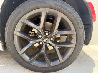 20 “ Dodge Charger wheels and Tires are 80%