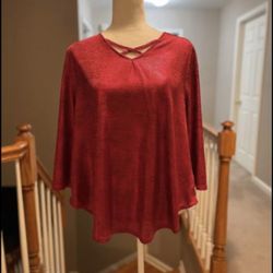 Great top, shimmery red, V-neck with cross bands, long sleeves, rounded hem. Retail price $59 Size Large petite