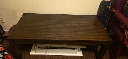 3 dark wood tables