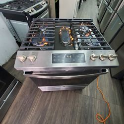 GE  5 BURNER NEW CONDITION WARRANTY SLIDE IN WITH BROIL 90 DAYS WARRANTY  NEW CONDITION..$550