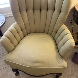 Antique wingback chair with Queen Anne legs
