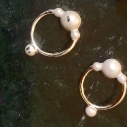 TWO SETS OF GOLD TONE RINGS 