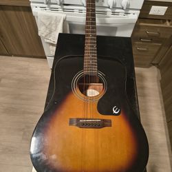 Acoustic Guitar $100.00