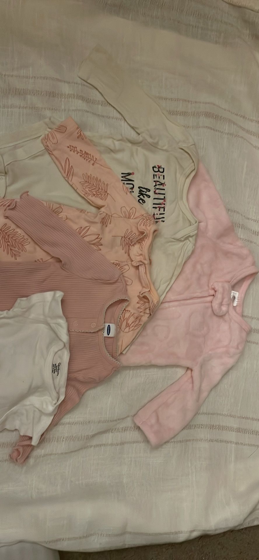 5 Newborn long sleeve onesie.