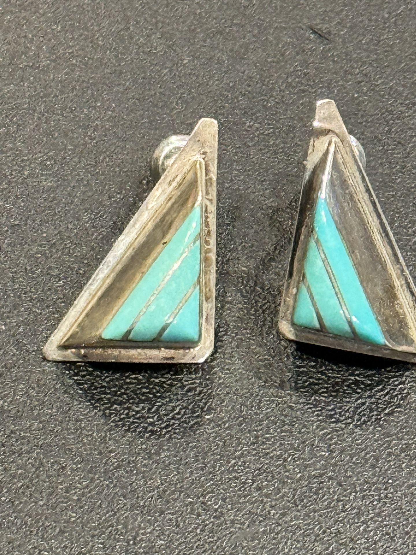 This is a striking Zuni inlaid unique teepee shaped silver earrings. These earrings are beautiful as they are each in a wonderful unique teepee shape 