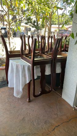 Dinner table set with chairs