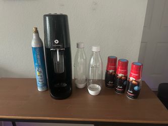 Soda Stream with unopened flavors and bottles