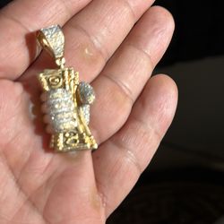 Gold charm with diamonds