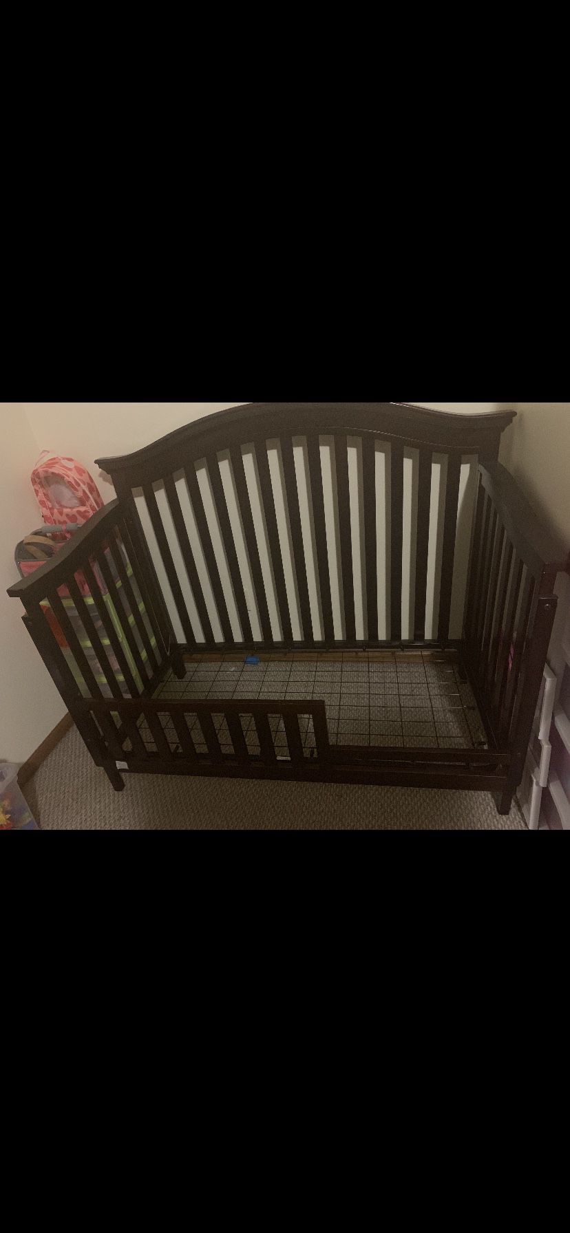 Crib/ with toddler bed conversion rail.
