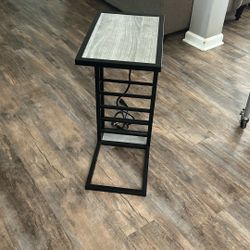 Nice table, you can plug your phone into or a lamp has a plug within it