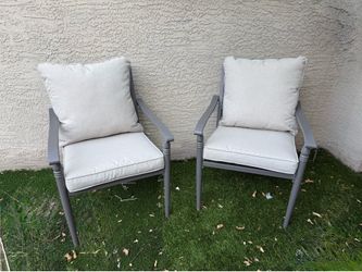 Set of two metal patio chairs