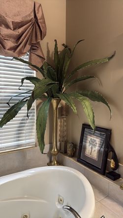 Tall vase with aloe flowers