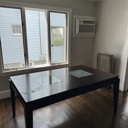 Large dark wood dining table (removable leaf) with 6 chairs