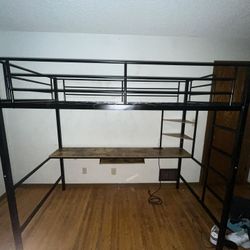 Twin sized bed frame with a desk