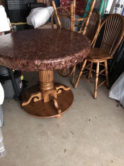Beautiful oak table and chairs. No children,pets, and non smoking clean home. Too tall for Senior citizen. New price $325