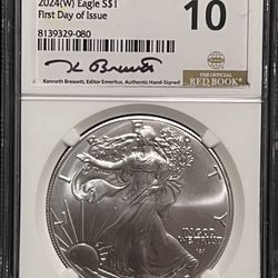2024 W Burnished American Silver Eagle • West Point Mint • Kenneth Brewster Signed, First Day of Issue Red Book Label • NGCX Mint State 10