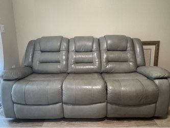 Grey leather electrical reclining Sofa complete with charging ports!
