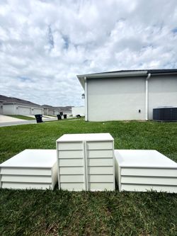 Selling a white cabinet with 2 large drawers.