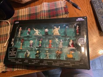 Jada Toys Disney Tim Burton's The Nightmare Before Christmas 18-Pack Nano Metalfigs, a collectible set featuring 1.65-inch die-cast metal figures of i