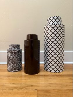 Set of 3 ceramic ginger jars w/ lids from Pottery Barn ($30); set of 3 vases ($20)