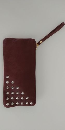 Brown leather clutch with wrist strap