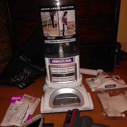 Like New 2 SHARK  Vacuums Lift Away Pro, With Everything Included.