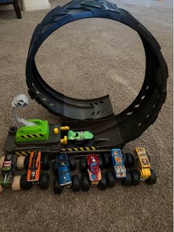 Hot wheels monster trucks and track.