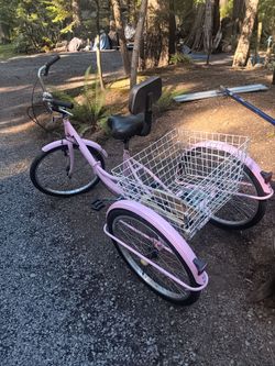 pink 3 wheel bike with basket and it folds up. can deliver