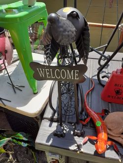 Cute little metal welcome dog