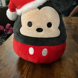 The Squishmallows Mickey Mouse 8" Santa Hat Kellytoy Christmas Collectible is a small 8-inch bear toy 