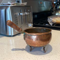 Small 3 Footed Copper Pot With Wooden Handle.