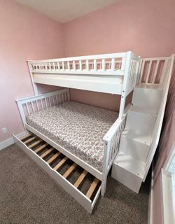 White twin bunk bed with trundle