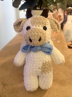 Crochet cow with blue bow
