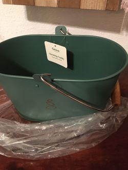 Green bucket and cleaning supplies