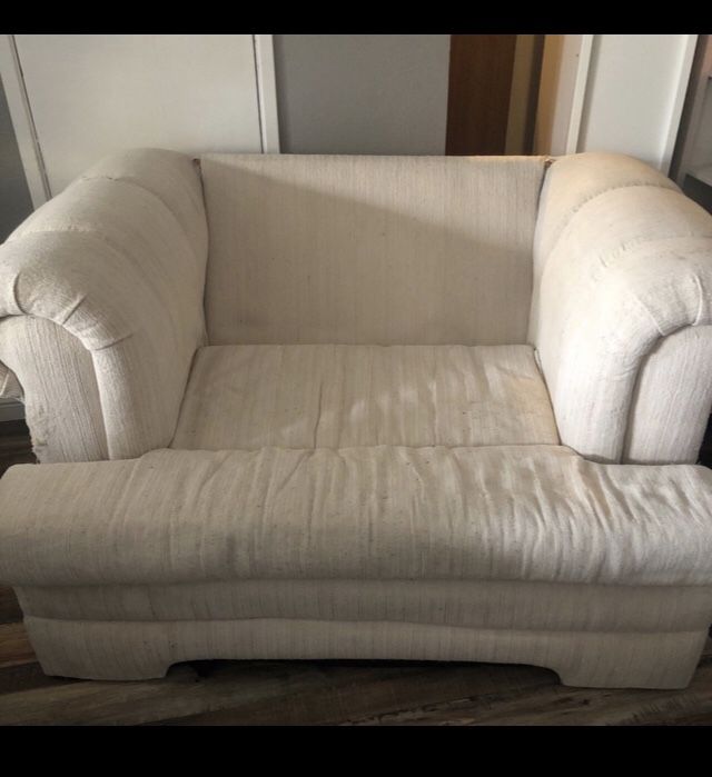 OVERSIZED SOFA CHAIR  **  Recommended reupholstering or slip cover  *** Frame is solid wood construction, very sturdy, long life left **  Cushions sti