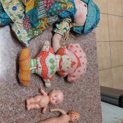 Four vintage and antique dolls.
