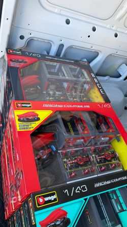 The best gift ever for f1 racing car fans Brand New F1 Bburago 1:43 Formula Racing Paddock Set Ferrari, Red Bull, or McLaren  Asking for $30 each