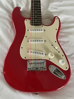 Squier Mini Stratocaster Electric Guitar, Dakota Red. Neon Multi-Color Strings