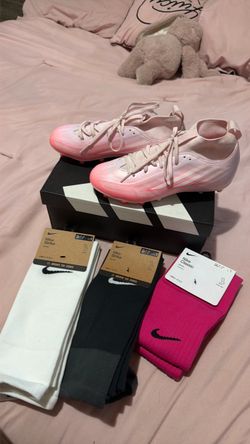 cleats, 1 knee high socks, 2 sleeve socks