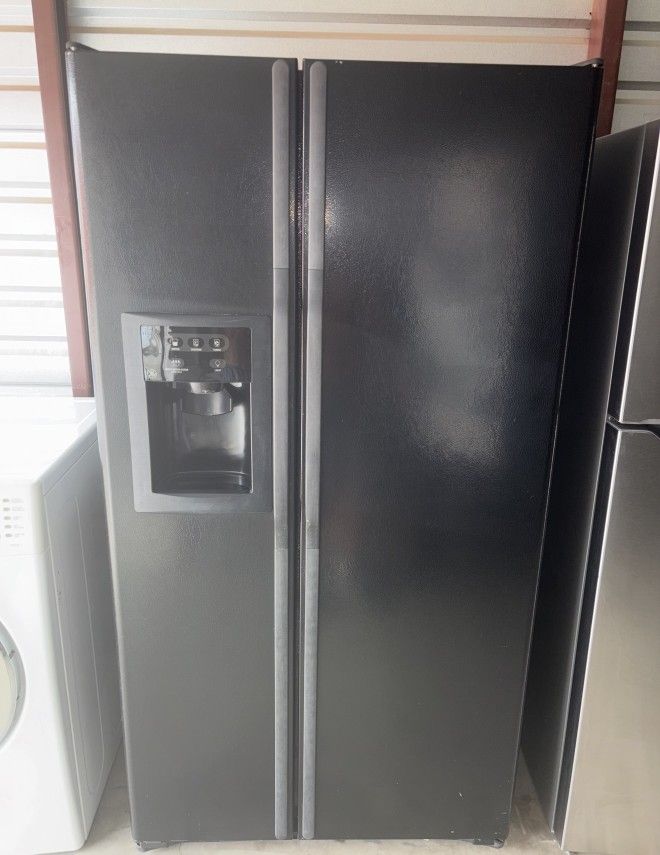 Black GE Refrigerator And Freezer