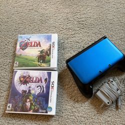 Good working Blue 3DS XL with grip, Ocarina of Time, and Majora's Mask.